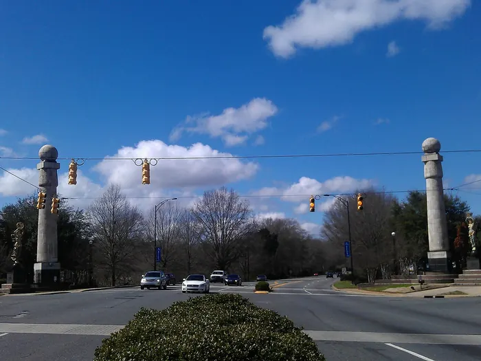 Tall columns topped with bronze statues at the Gateway on Dave Lyle Boulevard in Rock Hill